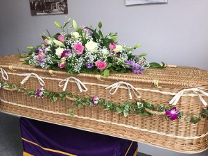 Floral Tribute on a Woven Coffin