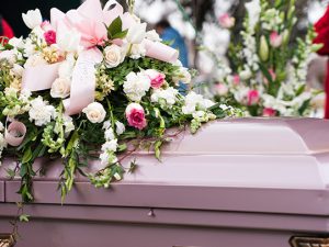 Pink Coffin with Floral Tribute